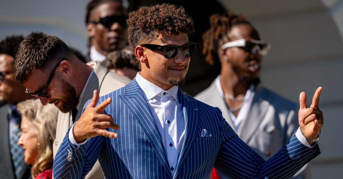 Kansas City Chiefs quarterback Patrick Mahomes (C) and tight end Travis Kelce (L) appear at an event with U.S. President Joe Biden